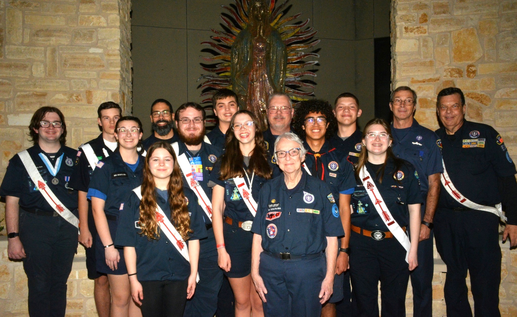 Youth and adult leaders of Sea Scout Ship Invincible of Houston, the 2024-25 BoatUS National Flagship Award honoree